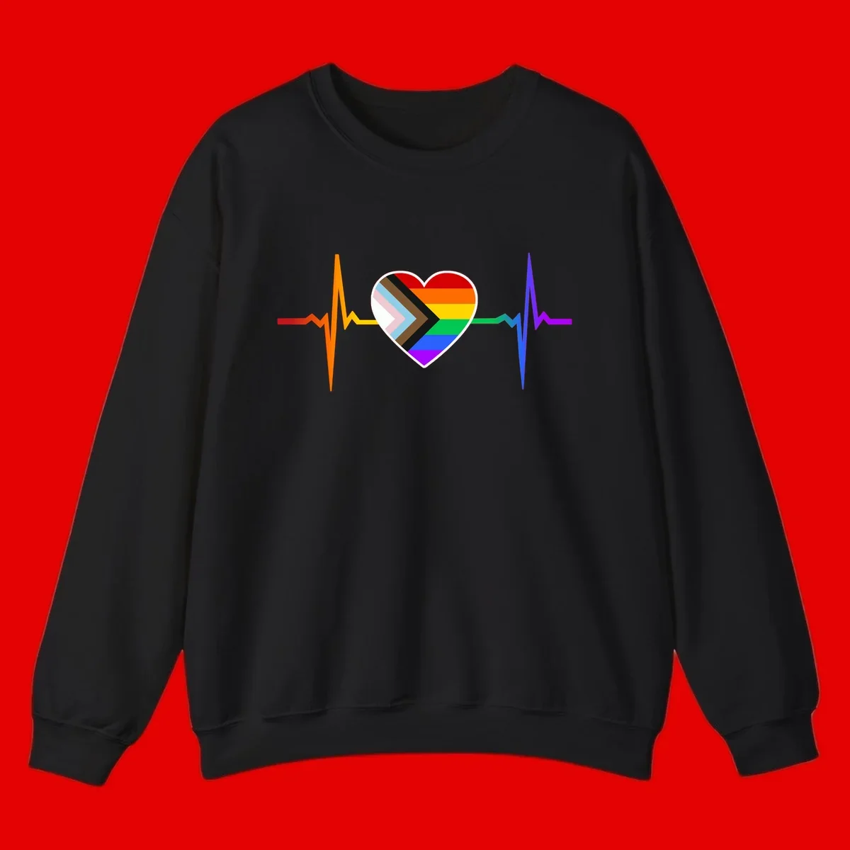 Progress pride heartbeat design featuring a rainbow heart with progress chevron arrow and electrocardiogram pulse line