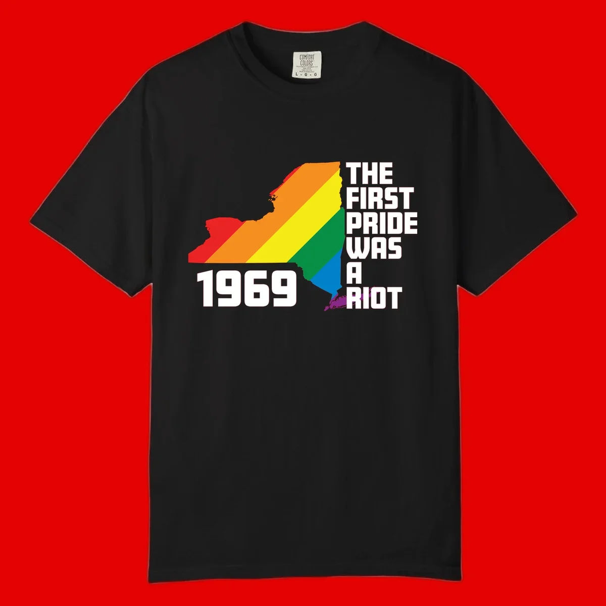 New York state map filled with rainbow pride stripes and text reading 'The First Pride Was A Riot 1969'