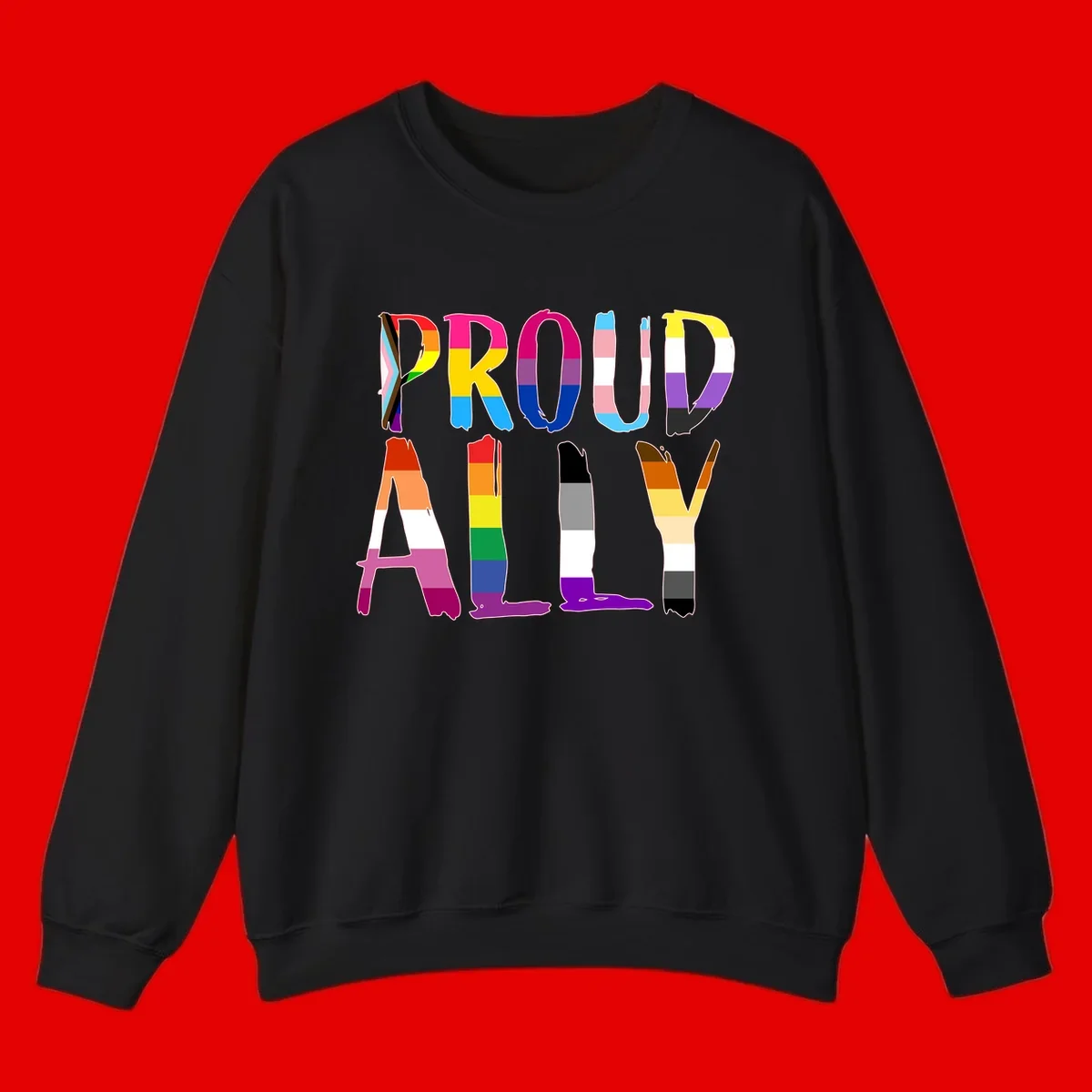 Colorful block letters spelling PROUD filled with rainbow pride flag stripes and patterns including trans and progress pride designs