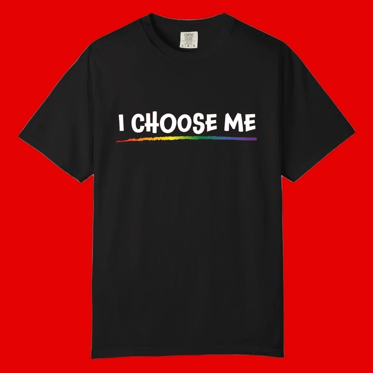 White text 'I Choose Me' above a vibrant rainbow gradient bar with pride flag colors on gray background