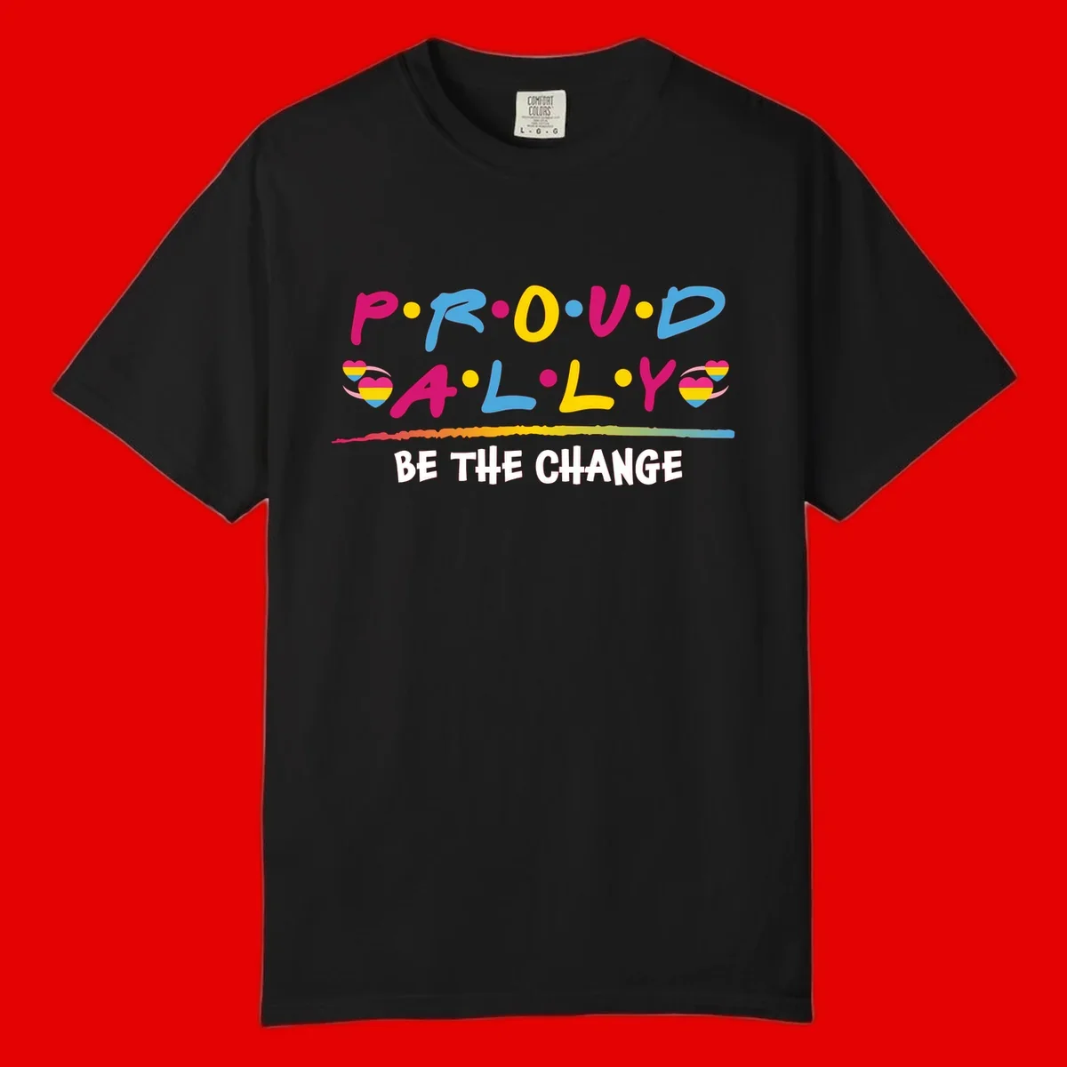 Colorful proud ally pride design with rainbow hearts, bold lettering spelling P.R.O.U.D and A.L.L.Y, and 'BE THE CHANGE' message