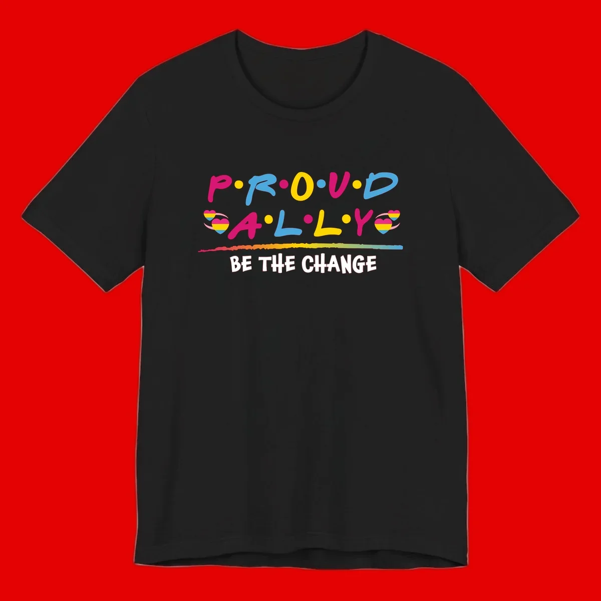 Colorful proud ally pride design with rainbow hearts, bold lettering spelling P.R.O.U.D and A.L.L.Y, and 'BE THE CHANGE' message