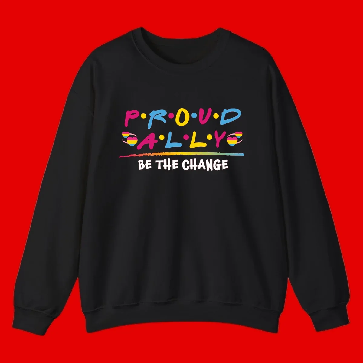 Colorful proud ally pride design with rainbow hearts, bold lettering spelling P.R.O.U.D and A.L.L.Y, and 'BE THE CHANGE' message