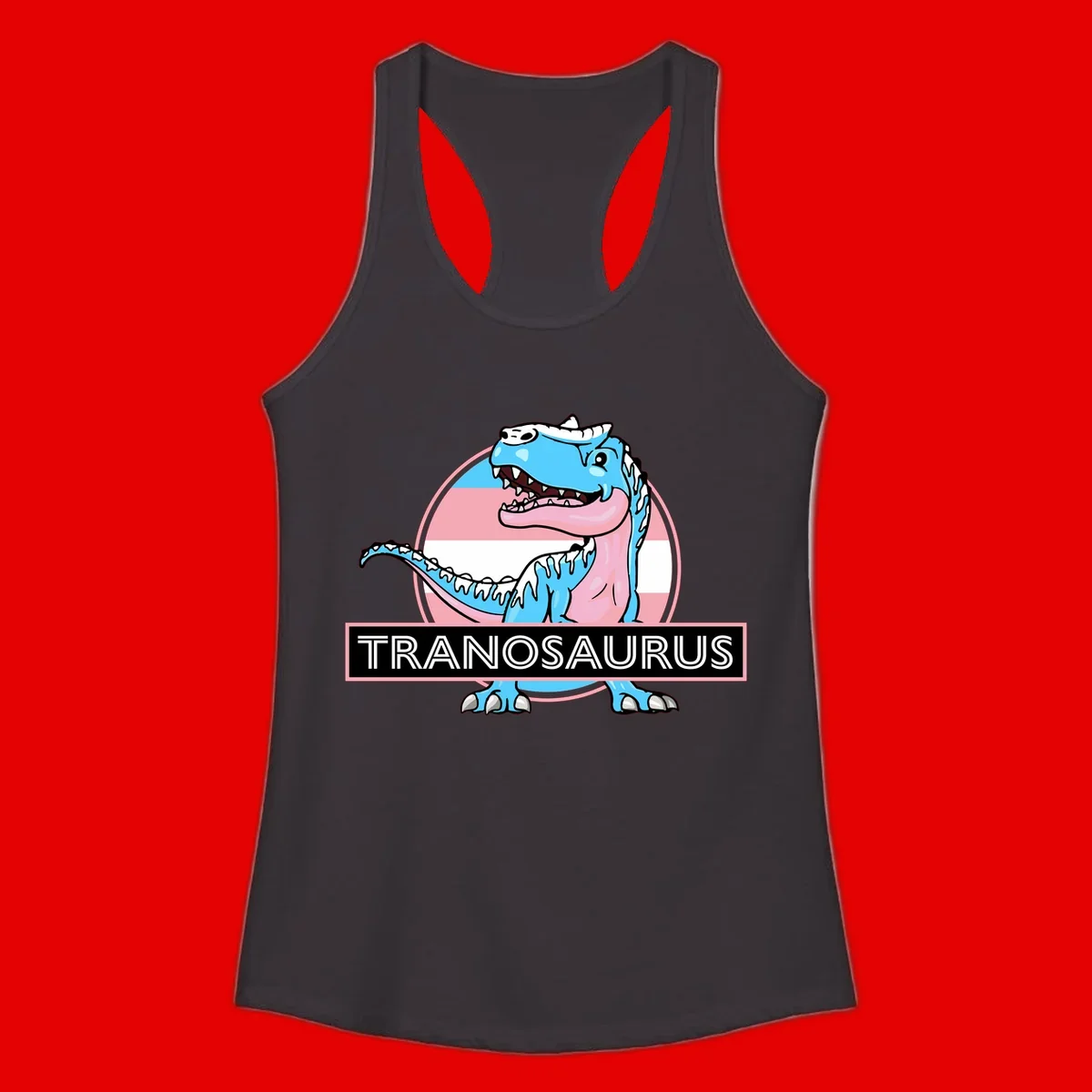 Blue cartoon T-Rex dinosaur with open mouth against pink and white pride flag circular background, labeled Tranosaurus