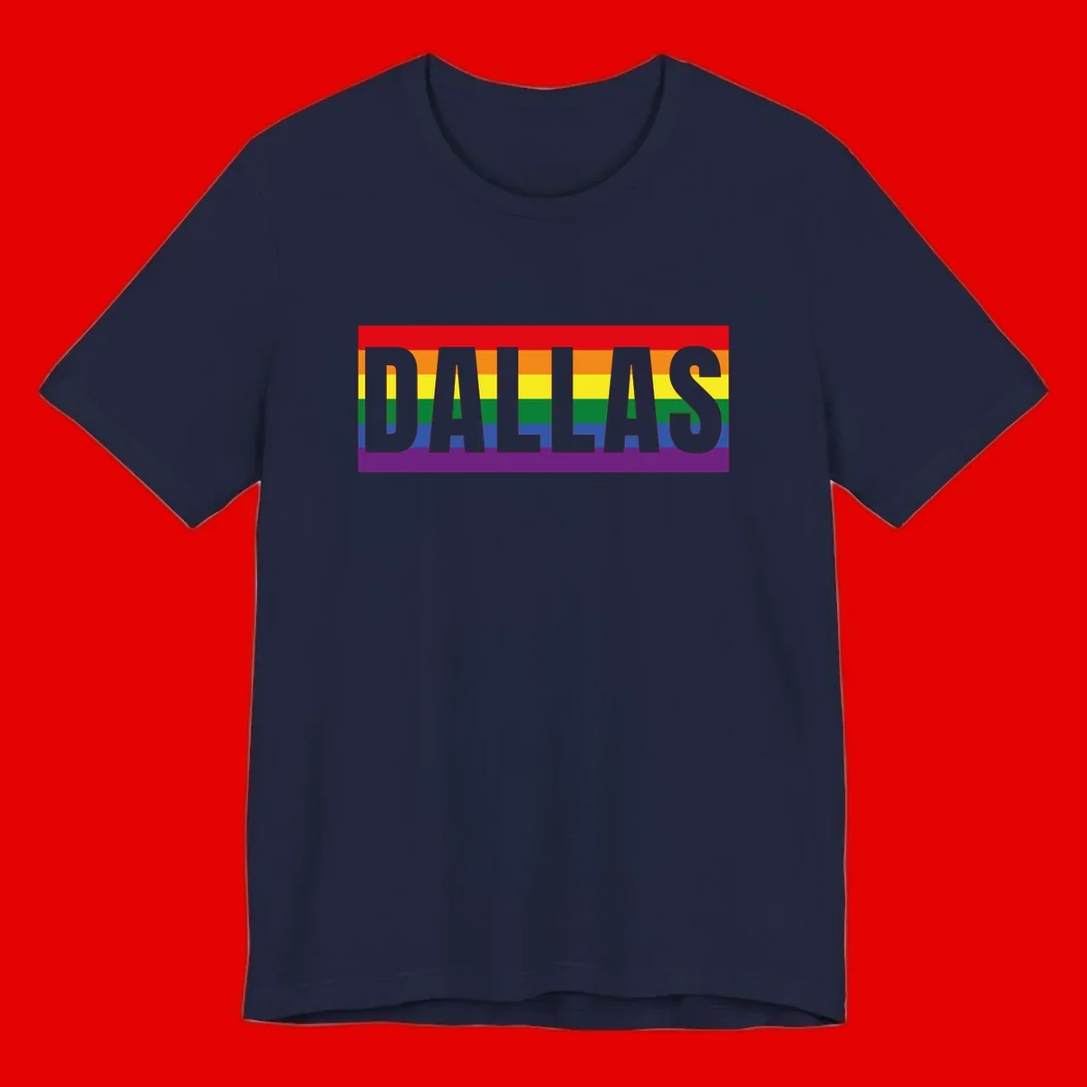 Gray DALLAS text overlaid on rainbow pride flag with red, orange, yellow, green, blue, and purple horizontal stripes