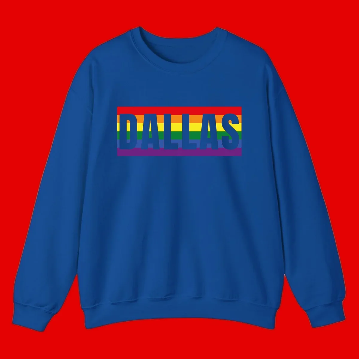 Gray DALLAS text overlaid on rainbow pride flag with red, orange, yellow, green, blue, and purple horizontal stripes