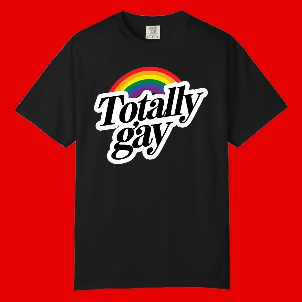Totally gay pride design with rainbow arc and bold black text on white banner celebrating LGBTQ identity