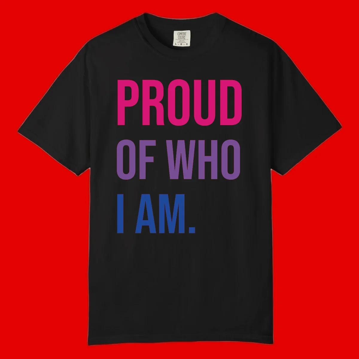 Bold colorful typography design reading 'PROUD OF WHO I AM' in magenta, purple, and blue letters on gray background