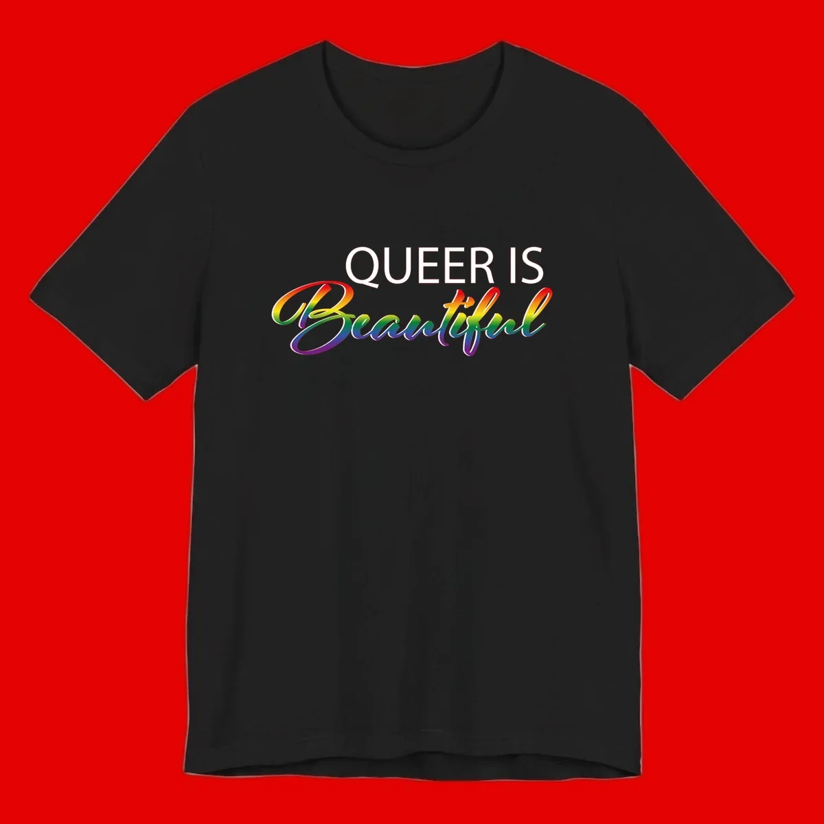 Rainbow gradient text reading 'Queer Is Beautiful' in pride flag colors on gray background