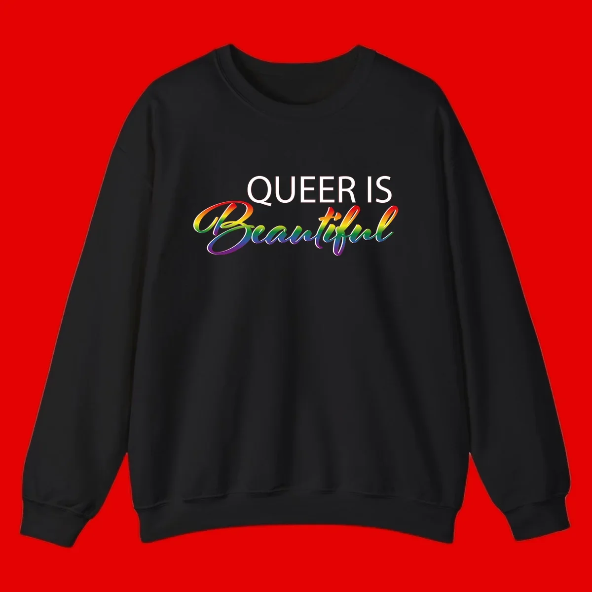 Rainbow gradient text reading 'Queer Is Beautiful' in pride flag colors on gray background