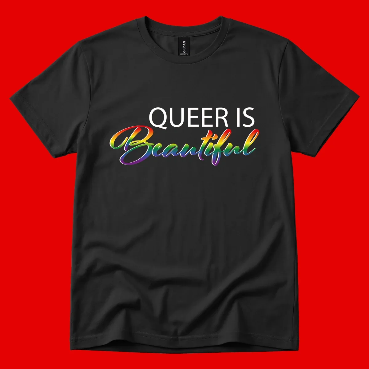 Rainbow gradient text reading 'Queer Is Beautiful' in pride flag colors on gray background