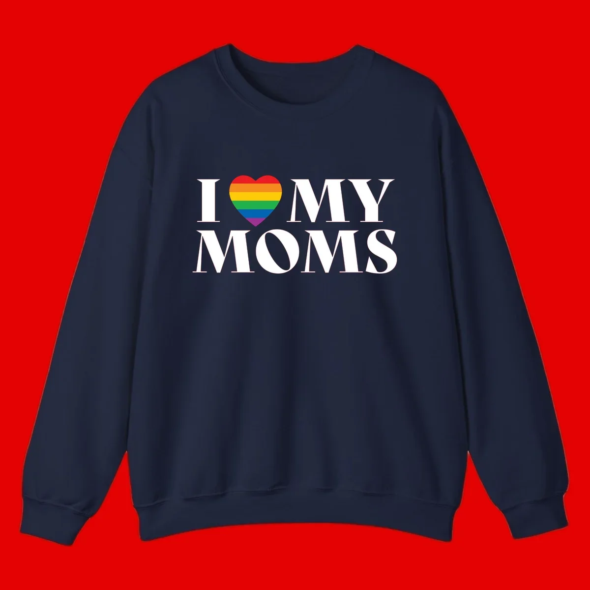 White text reading 'I love my moms' with a rainbow-striped heart symbol, celebrating LGBTQ+ family pride
