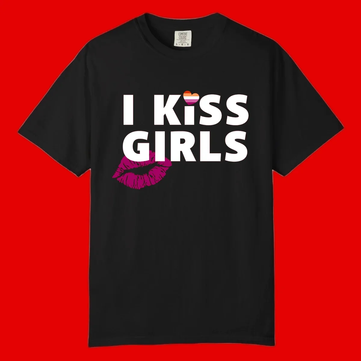 I Kiss Girls pride design with magenta lip print, rainbow heart, and bold white lettering celebrating lesbian identity