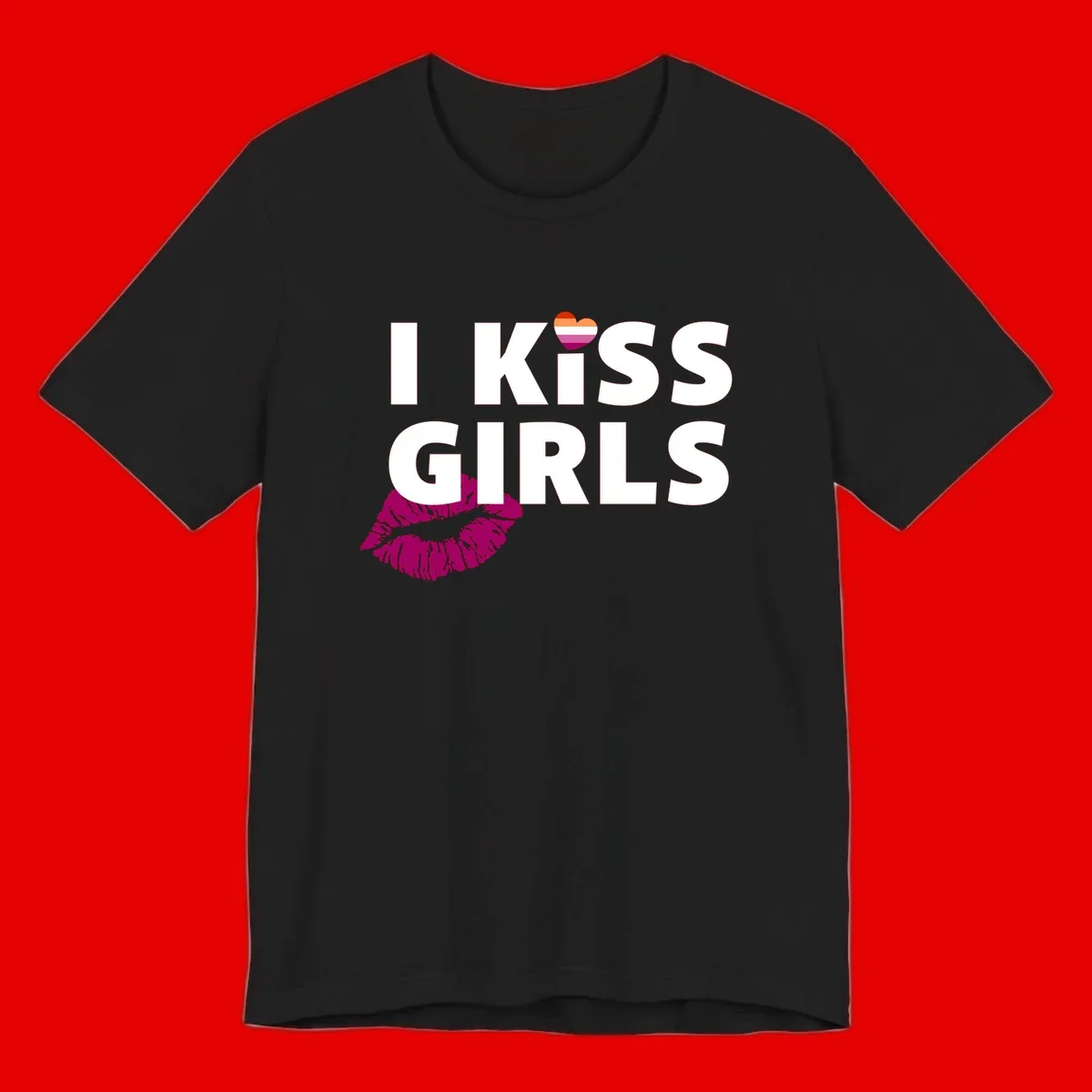 I Kiss Girls pride design with magenta lip print, rainbow heart, and bold white lettering celebrating lesbian identity