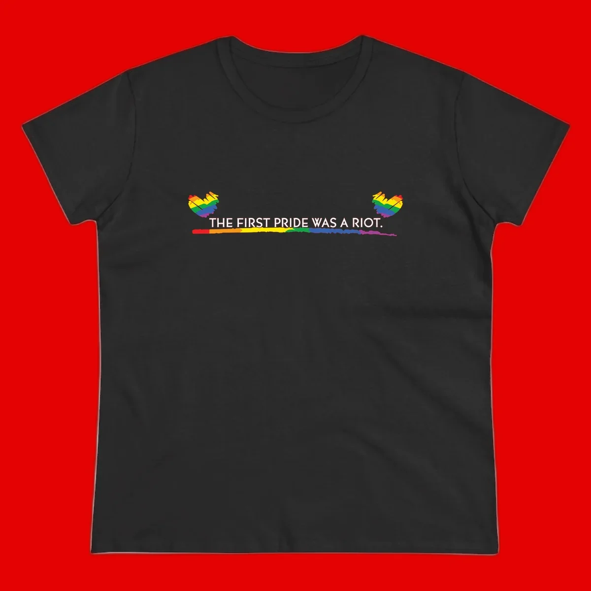 Gray background with white text reading 'THE FIRST PRIDE WAS A RIOT' surrounded by rainbow pride hearts and gradient stripe