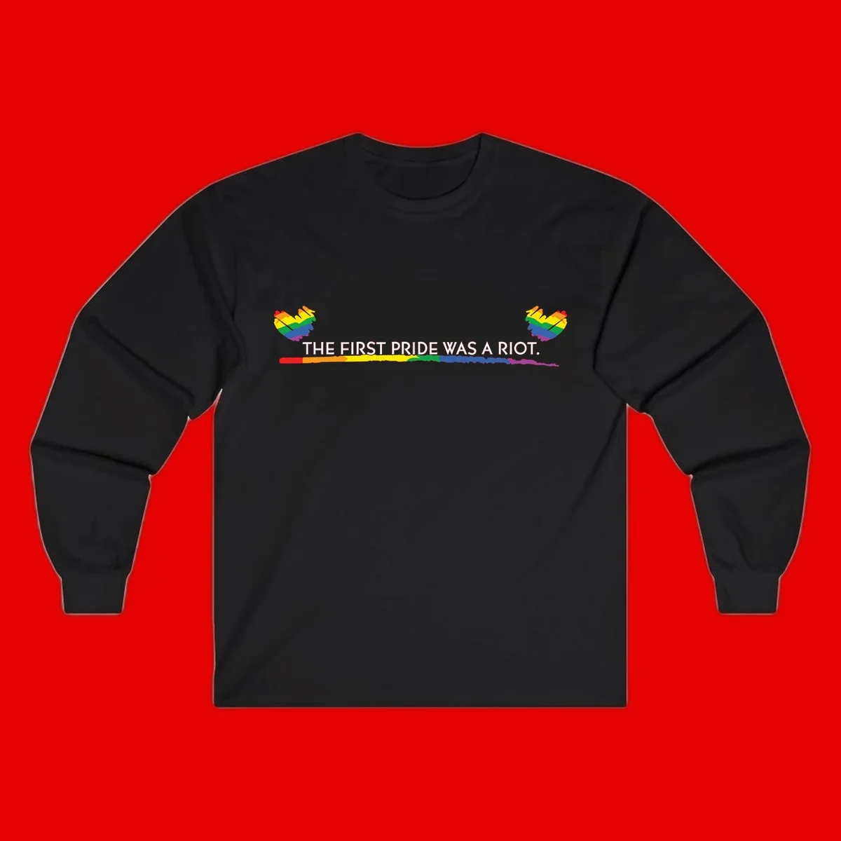 Gray background with white text reading 'THE FIRST PRIDE WAS A RIOT' surrounded by rainbow pride hearts and gradient stripe