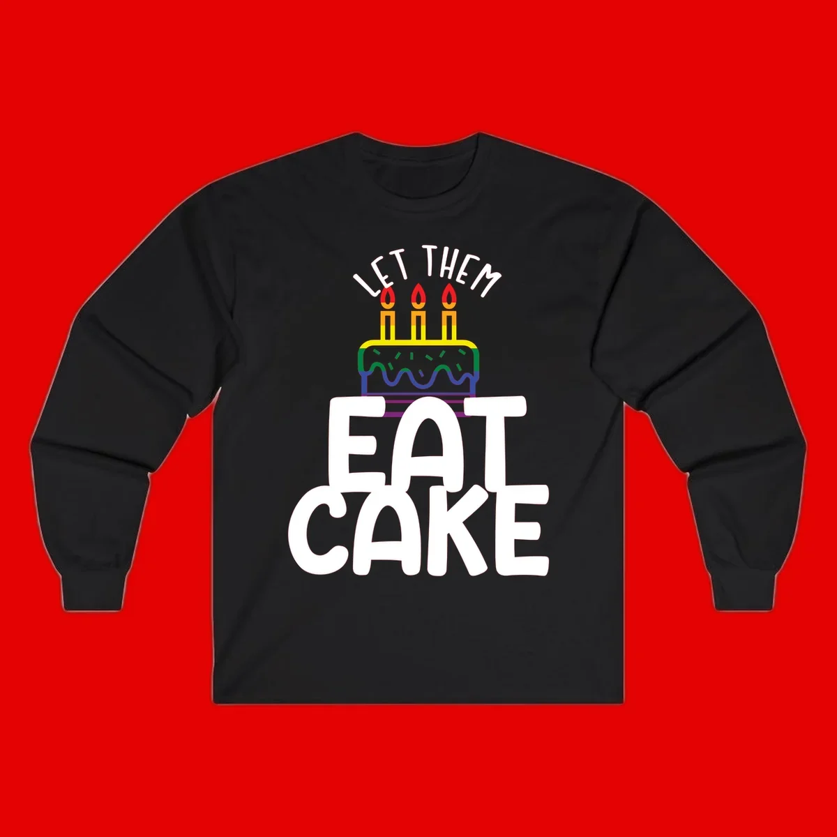 Rainbow-layered birthday cake with three candles above bold white text reading 'Let Them Eat Cake' - a Pride-themed design