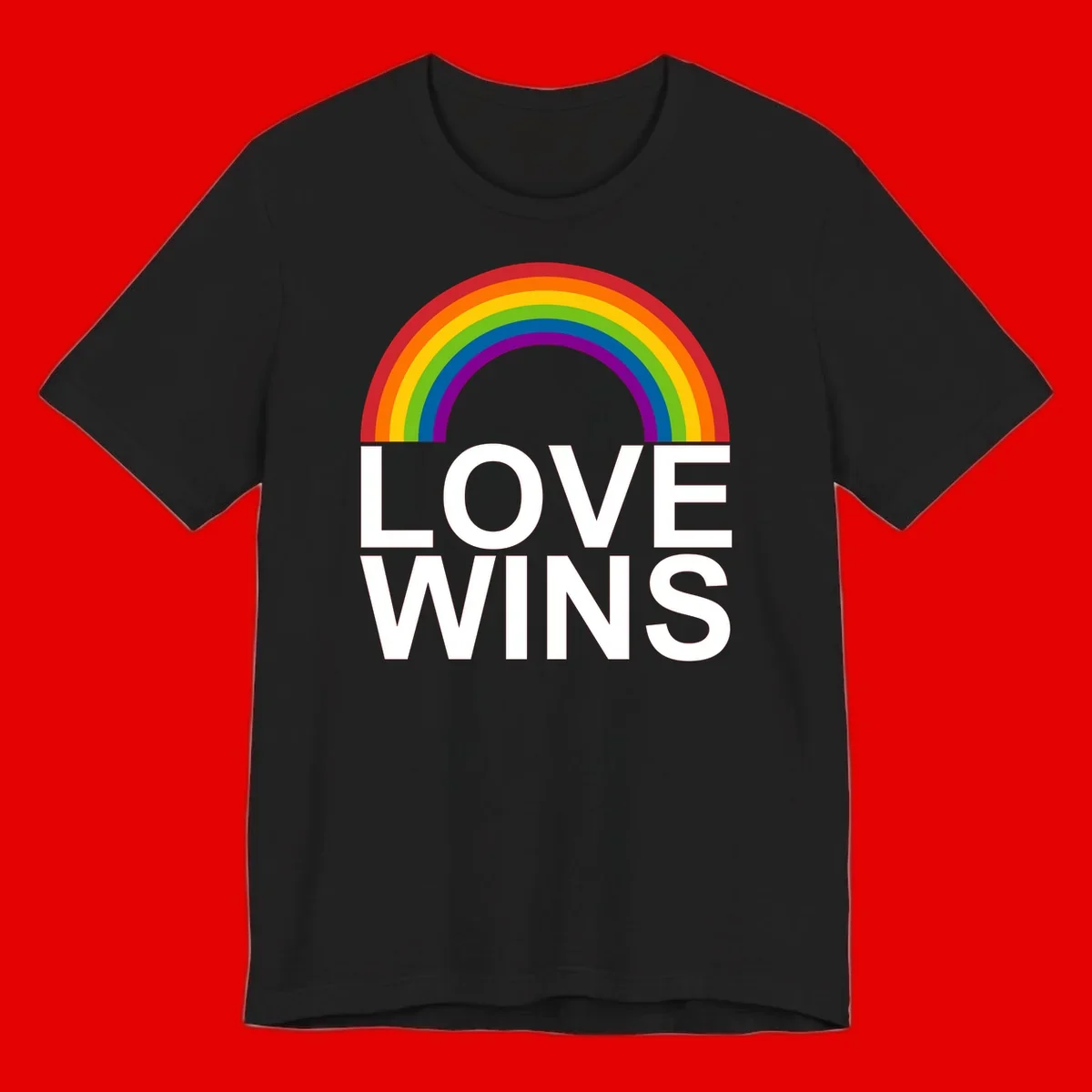 Rainbow arc above white text reading 'Love Wins' on gray background, pride equality design