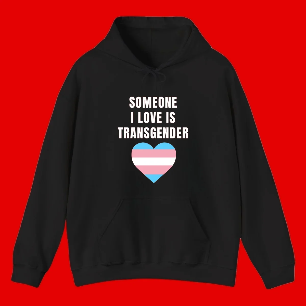 Gray background with white text reading 'Someone I Love Is Transgender' above a heart featuring blue, pink, and white transgender flag stripes