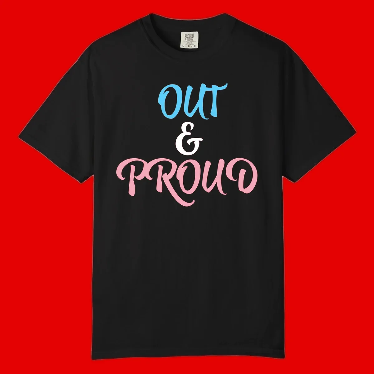 Out and proud pride design with blue 'OUT' text, white ampersand, and pink 'PROUD' lettering on gray background