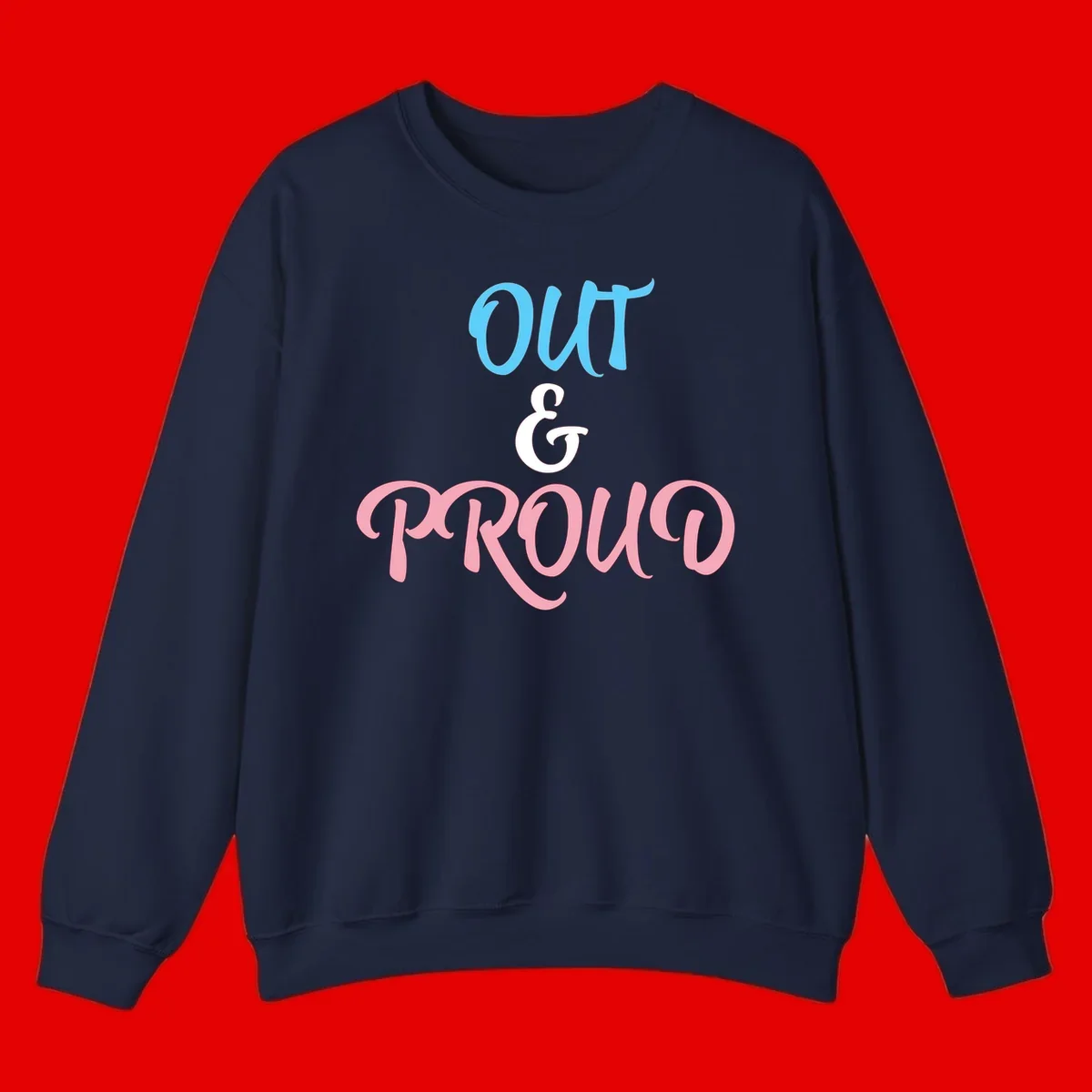 Out and proud pride design with blue 'OUT' text, white ampersand, and pink 'PROUD' lettering on gray background