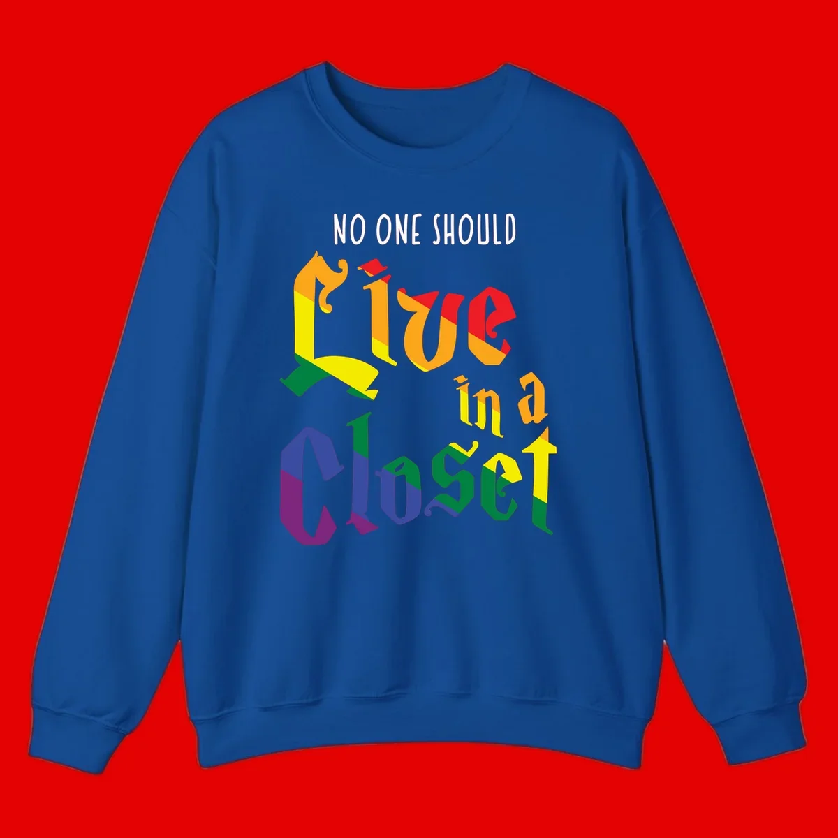 Rainbow gradient text reading 'NO ONE SHOULD LIVE IN A CLOSET' in bold, dimensional letters featuring pride flag colors on gray background