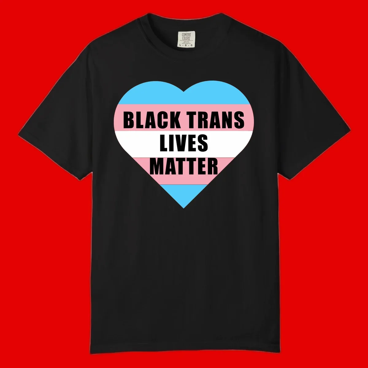 Heart-shaped design with trans flag stripes (blue, pink, white) and bold text reading 'BLACK TRANS LIVES MATTER'