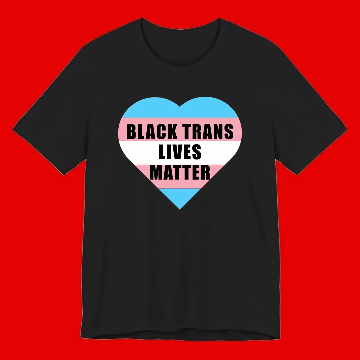 Heart-shaped design with trans flag stripes (blue, pink, white) and bold text reading 'BLACK TRANS LIVES MATTER'