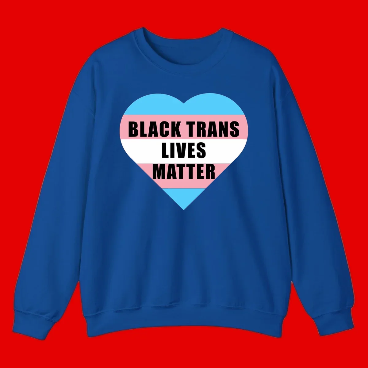 Heart-shaped design with trans flag stripes (blue, pink, white) and bold text reading 'BLACK TRANS LIVES MATTER'