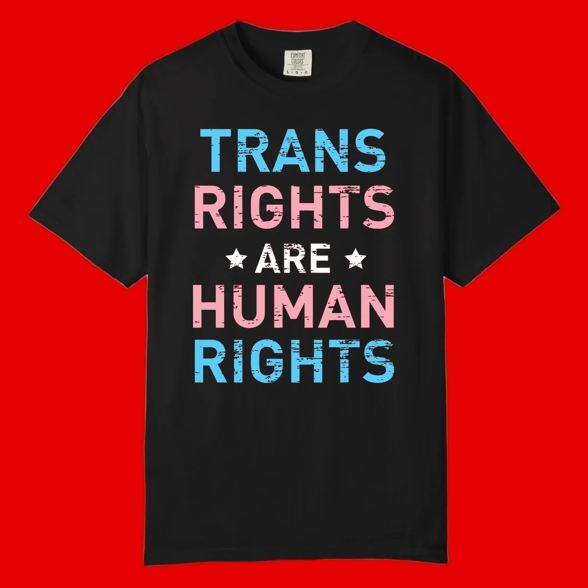 Distressed typography design reading 'TRANS RIGHTS ARE HUMAN RIGHTS' in cyan, pink, and white text with decorative stars on gray background