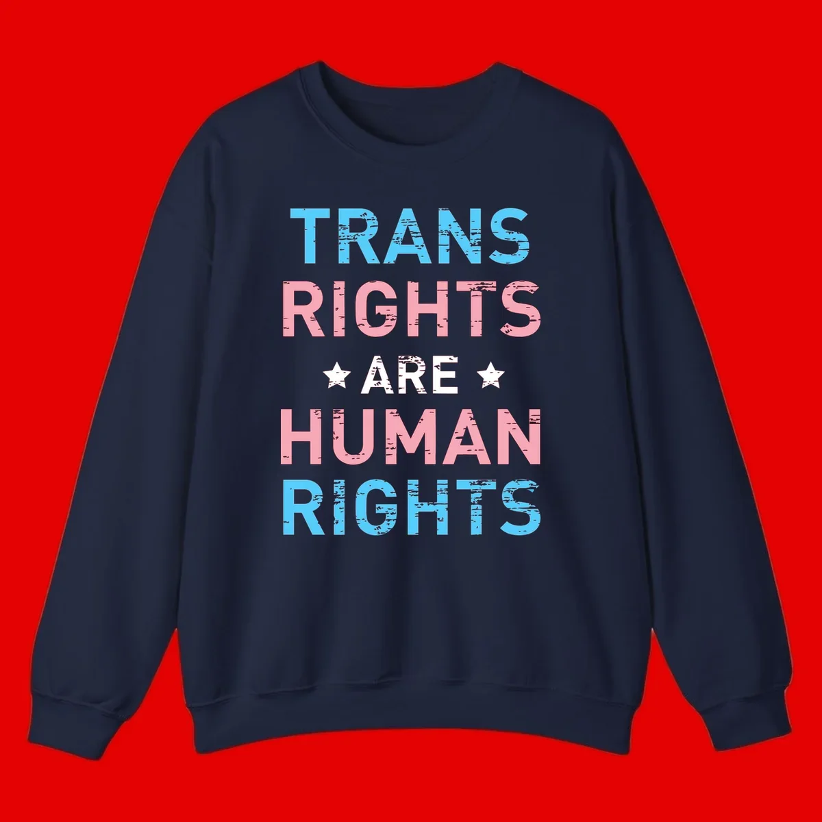 Distressed typography design reading 'TRANS RIGHTS ARE HUMAN RIGHTS' in cyan, pink, and white text with decorative stars on gray background