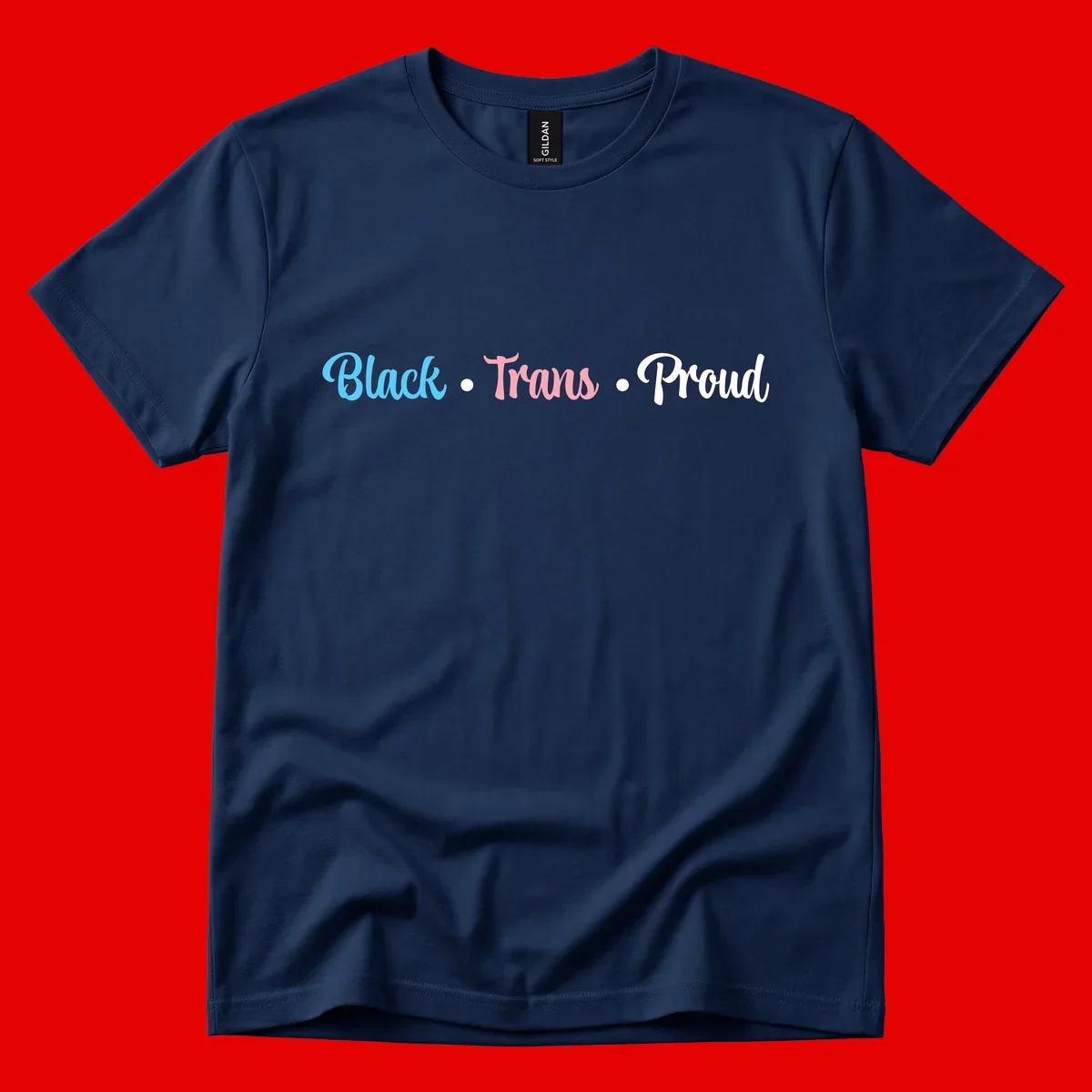 Black Trans Proud design with blue, pink, and white text on gray background, featuring decorative dots