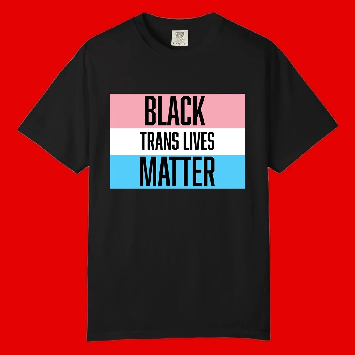 Black Trans Lives Matter design with bold text on trans pride flag colored horizontal stripes: pink, white, and blue