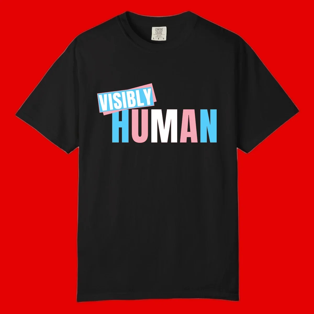 Bold typography design reading 'VISIBLY HUMAN' in cyan, pink, and white letters with diagonal 'VISIBLY' banner overlay on gray background