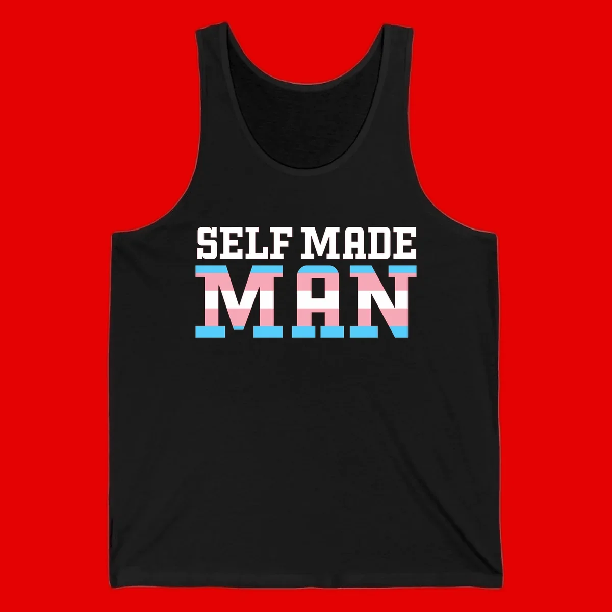 Bold 'Self Made' text filled with transgender pride flag stripes in blue, pink, and white on gray background