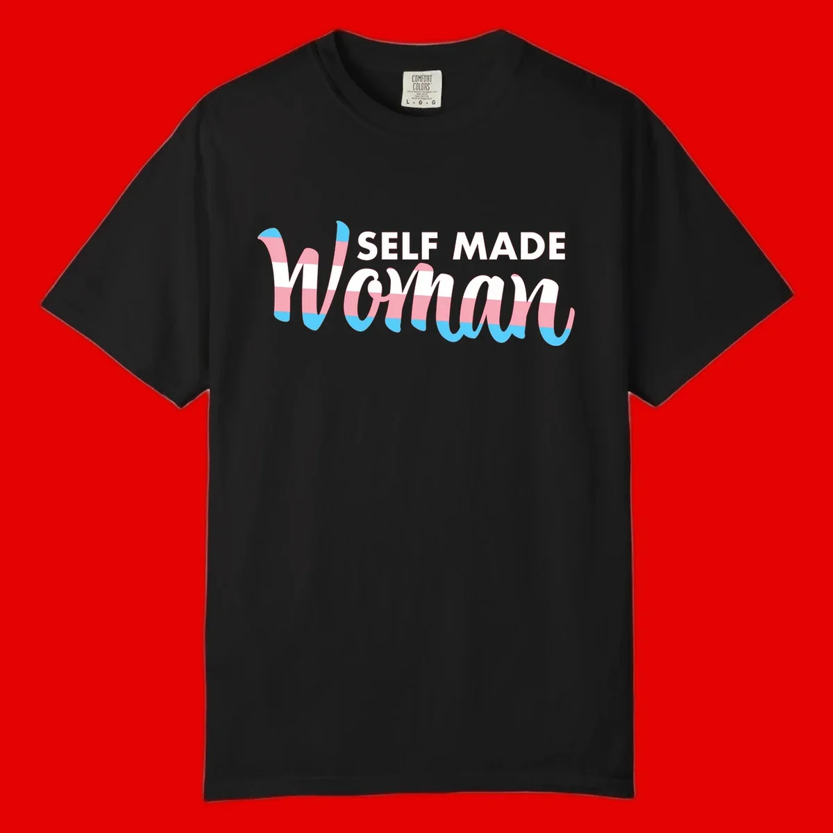 Self Made Woman design featuring bold wavy striped lettering in pink, white, and blue trans flag colors