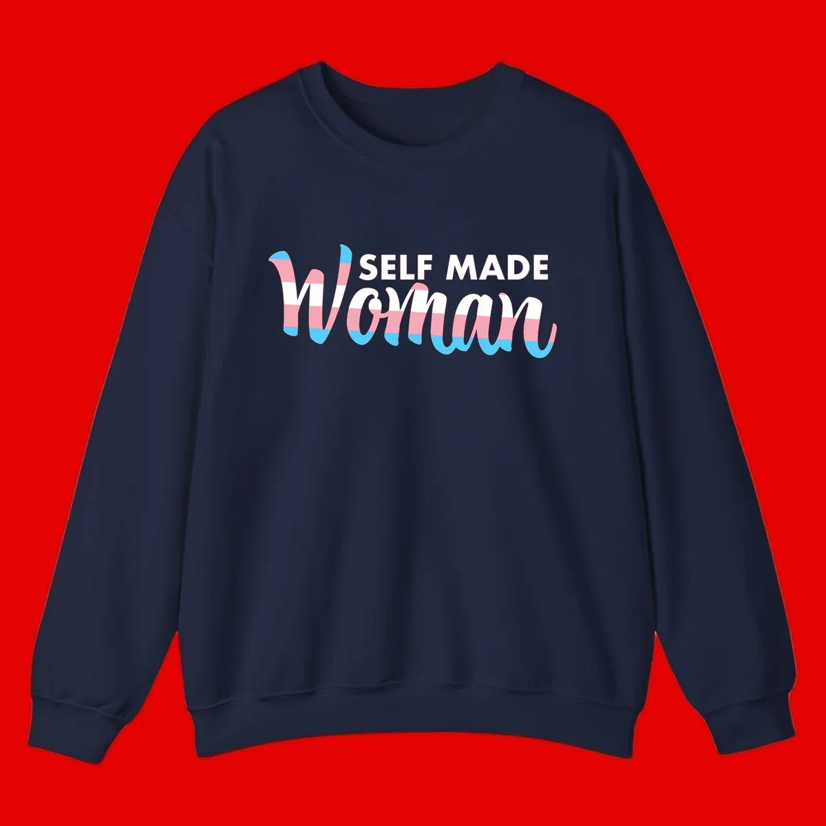 Self Made Woman design featuring bold wavy striped lettering in pink, white, and blue trans flag colors