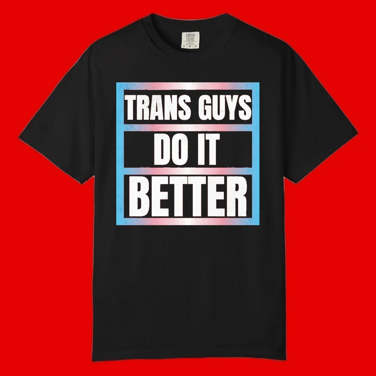 Bold white text reading 'TRANS GUYS DO IT BETTER' on gray bands with transgender flag watercolor background in blue, pink, and white.