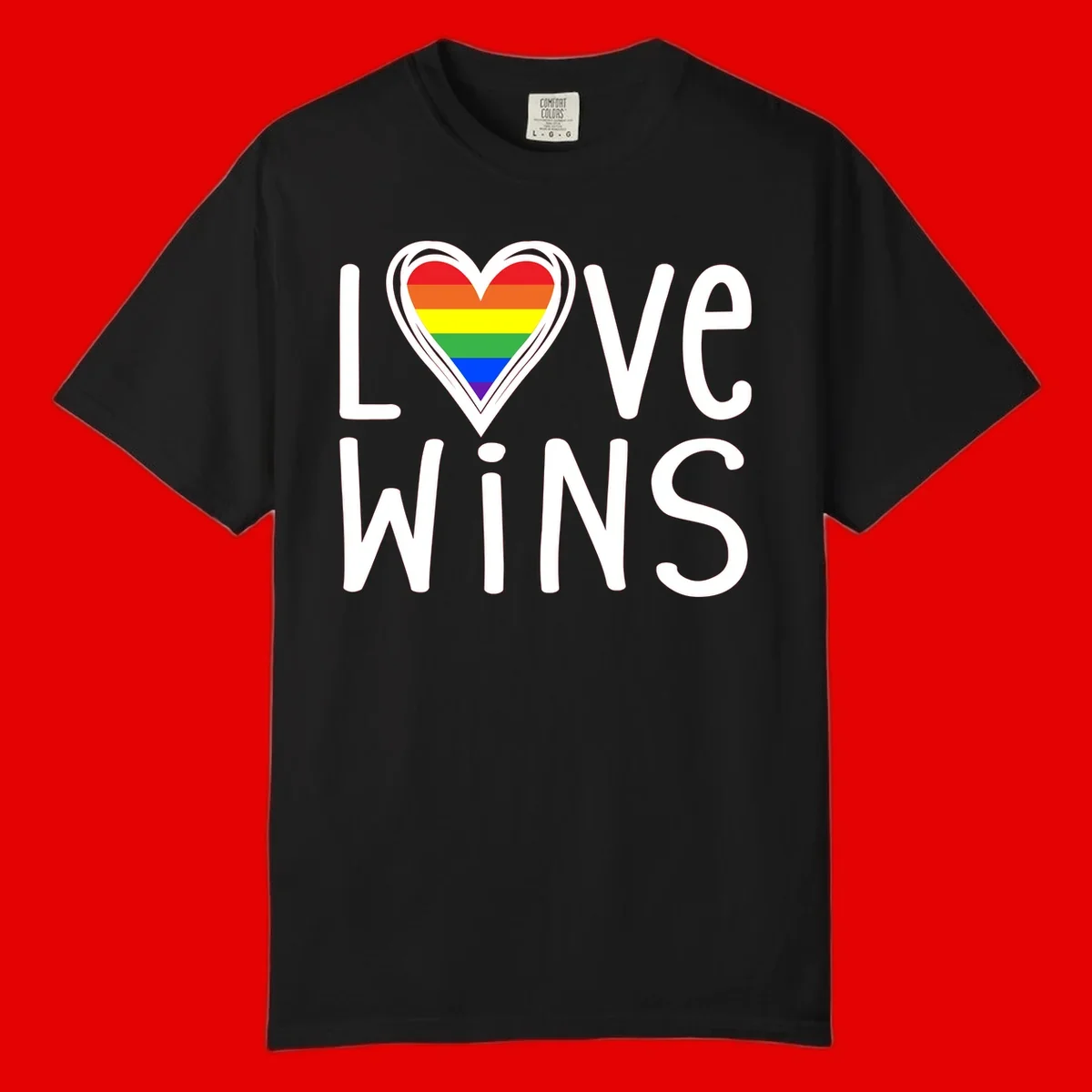 Love wins rainbow heart design with pride flag colors in white outlined heart shape and text