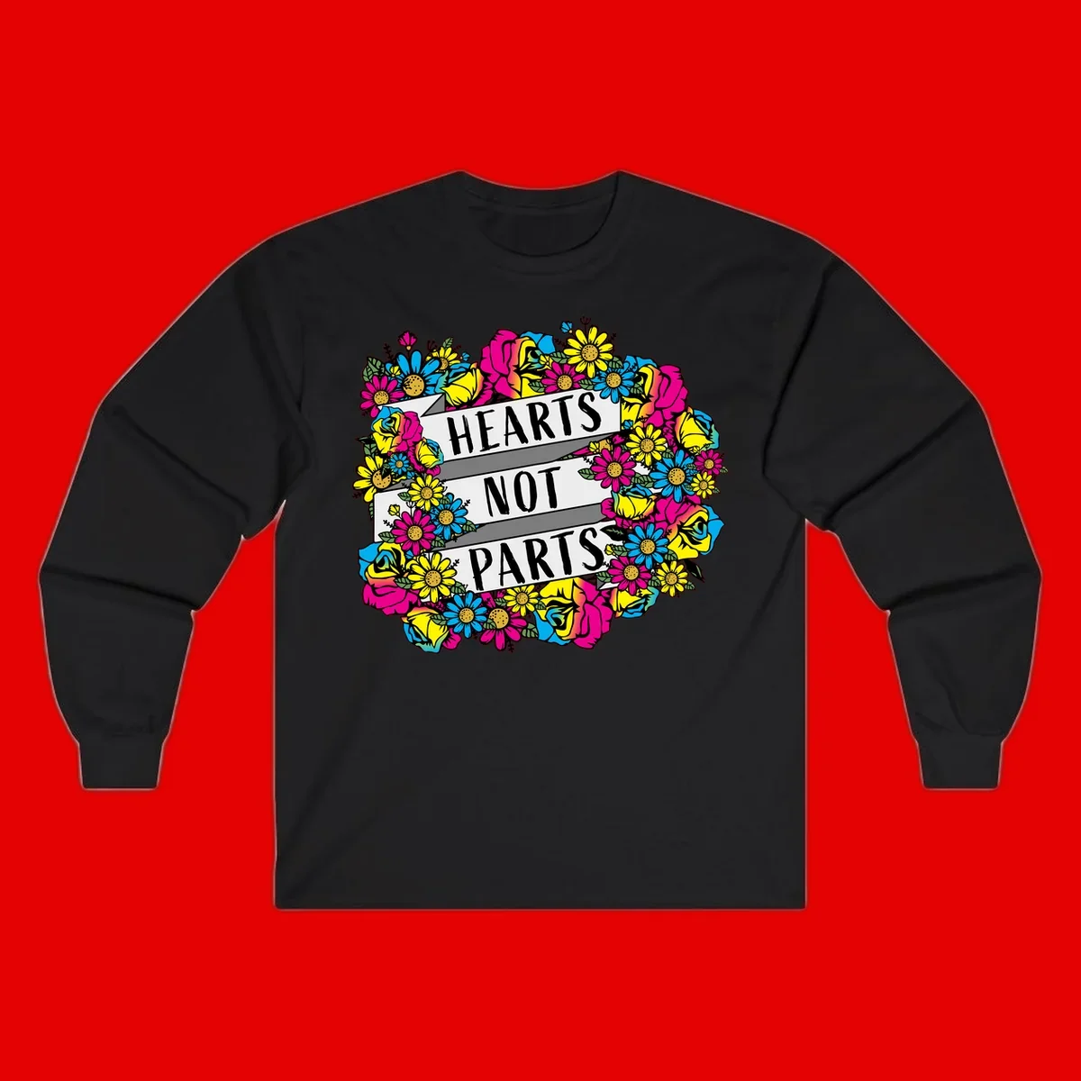 Hearts Not Parts pride design with colorful floral wreath featuring yellow daisies, magenta roses, and blue flowers surrounding bold statement text