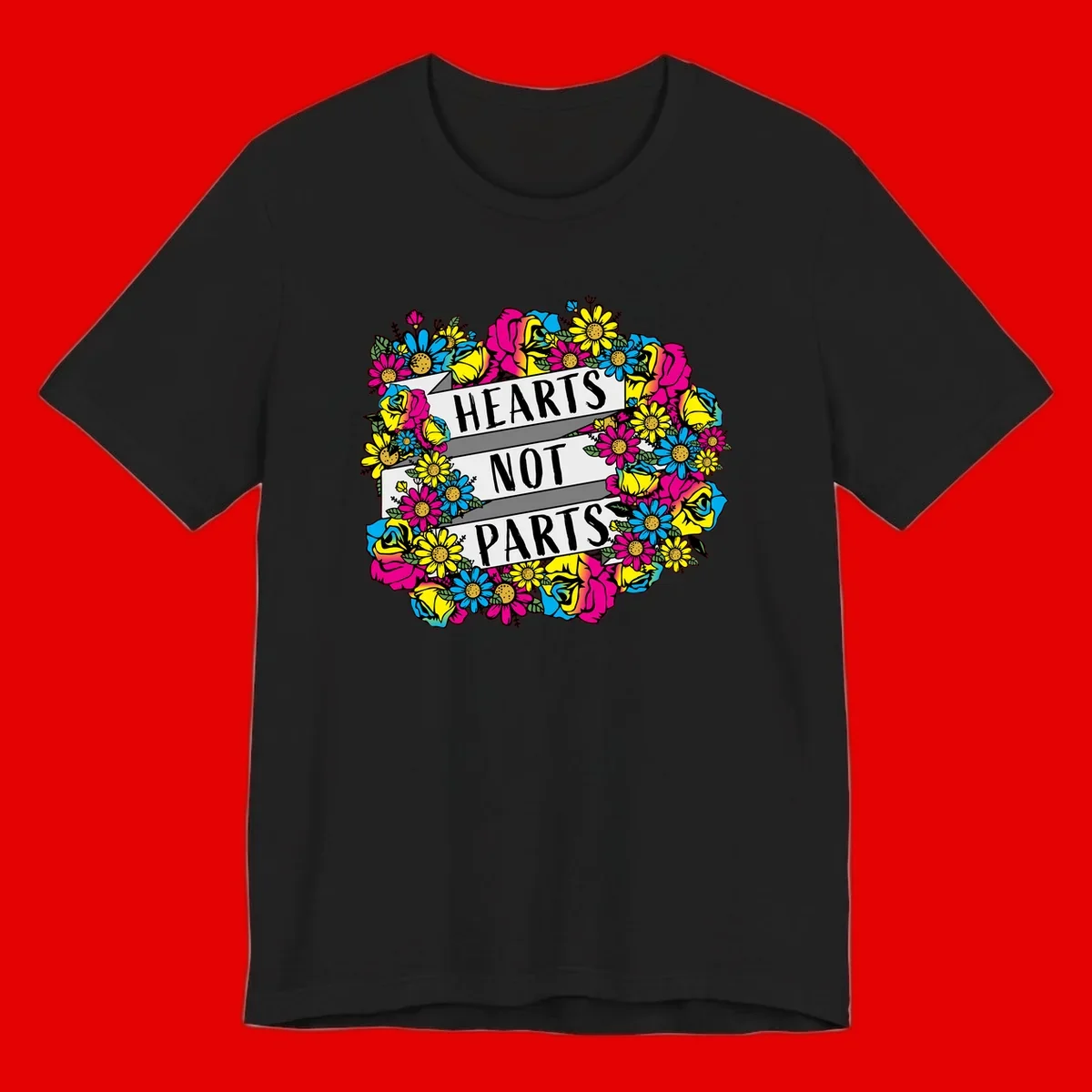 Hearts Not Parts pride design with colorful floral wreath featuring yellow daisies, magenta roses, and blue flowers surrounding bold statement text