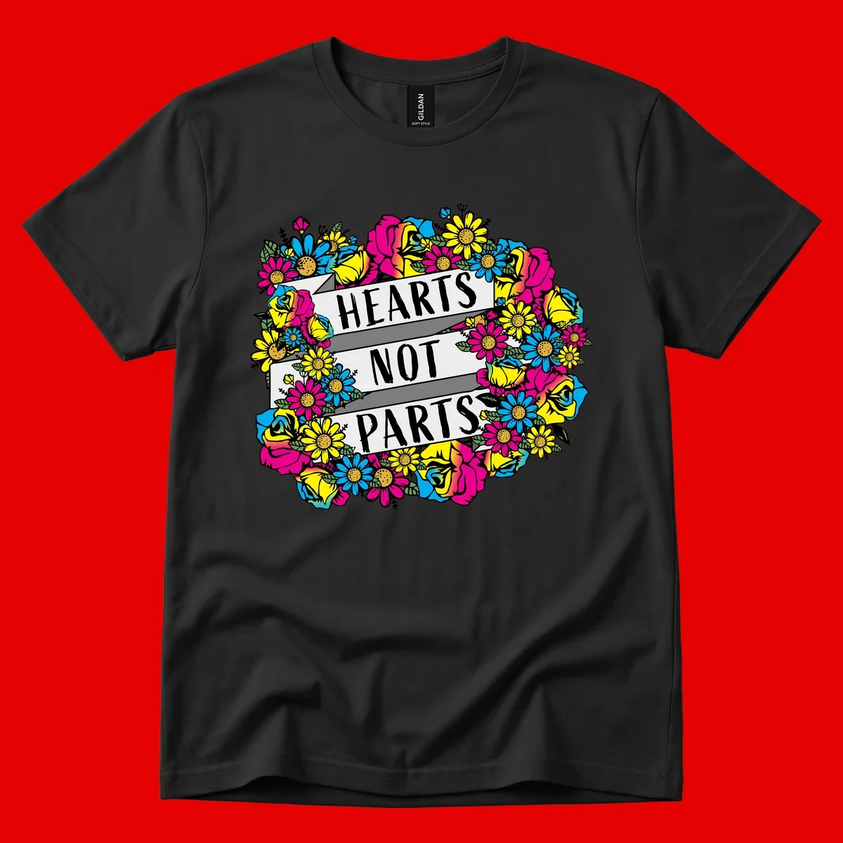 Hearts Not Parts pride design with colorful floral wreath featuring yellow daisies, magenta roses, and blue flowers surrounding bold statement text
