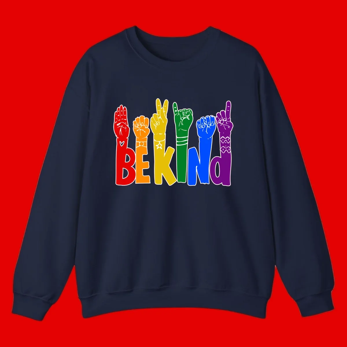Six colorful raised fists in rainbow colors with 'BE KIND' text, promoting pride, equality, and inclusive messaging