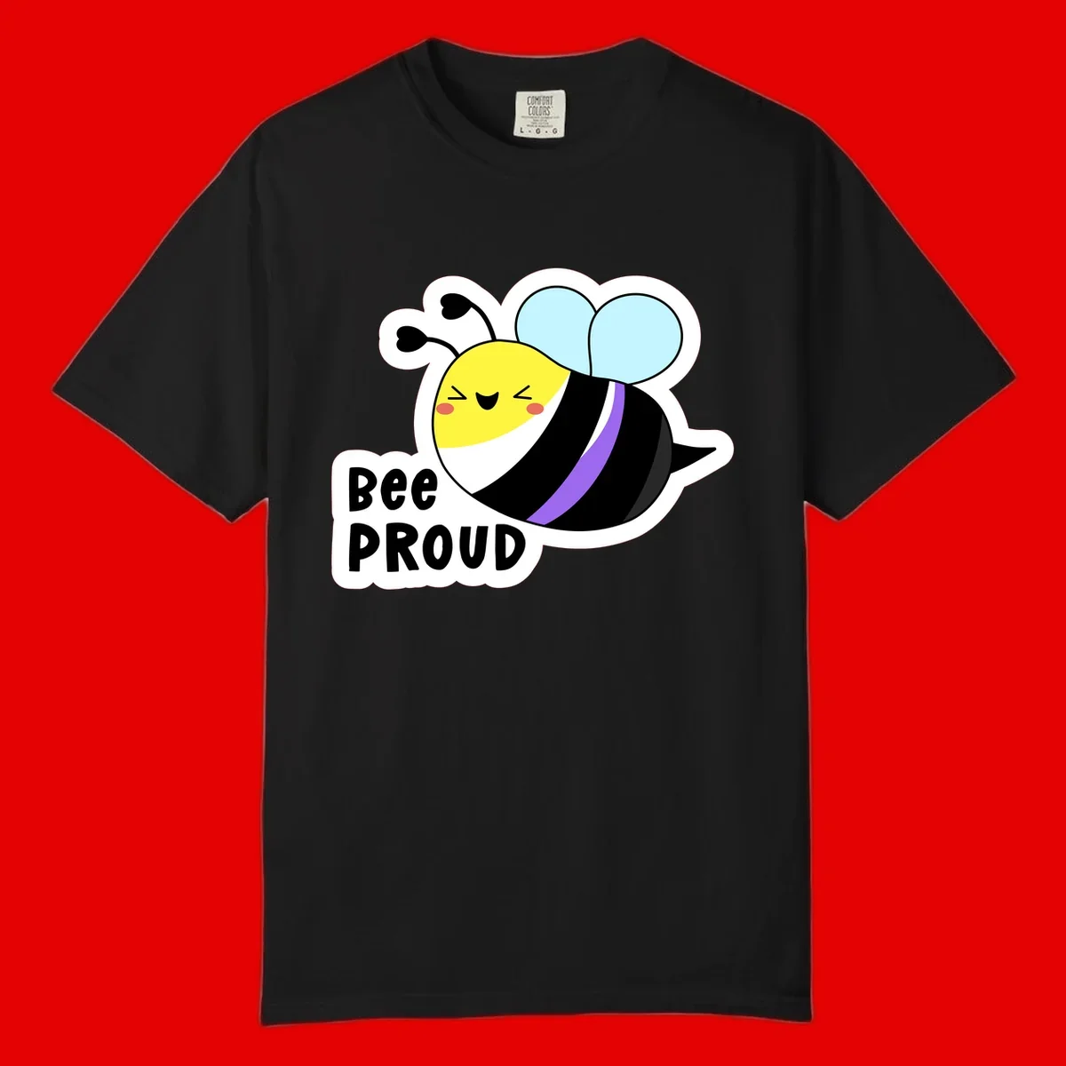 Cartoon bee with yellow head, purple-striped black body, and blue wings smiling happily with text 'BEE PROUD' below