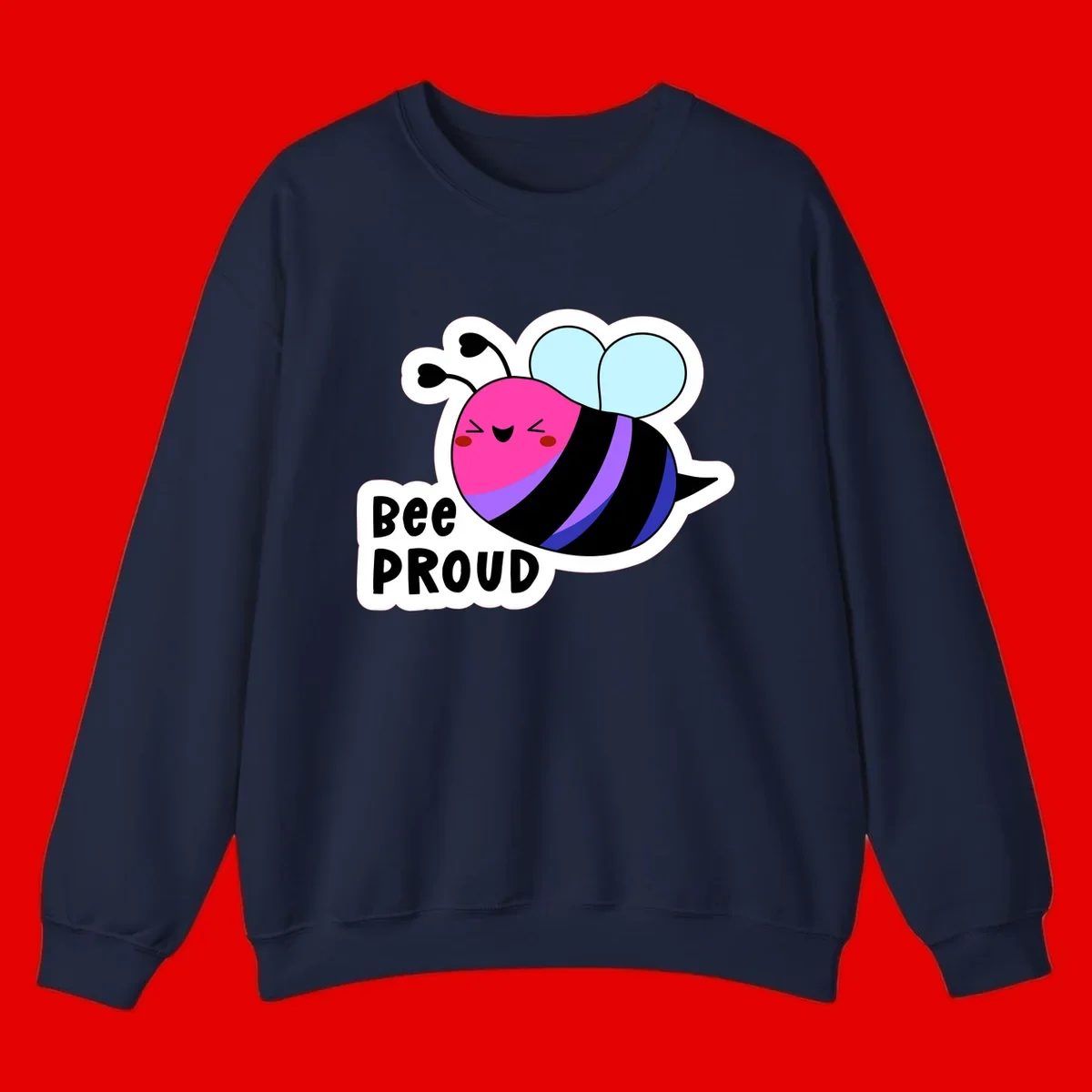 Colorful cartoon bee with pink head, rainbow-striped body, light blue wings, smiling face, and 'BEE PROUD' text