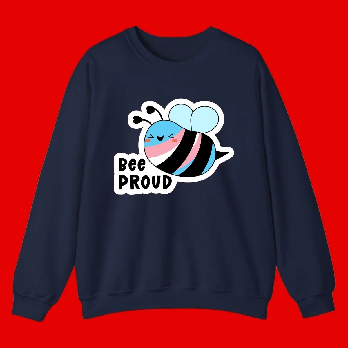 Smiling cartoon bee with blue head, pink mouth, striped body, and light blue wings next to 'Bee Proud' text