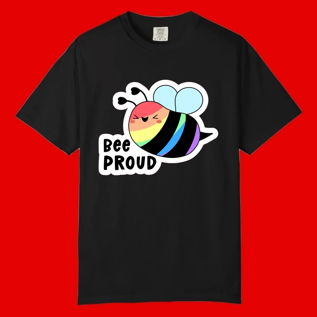 Cartoon bee with rainbow stripes and 'Bee PROUD' text celebrating LGBTQ+ pride