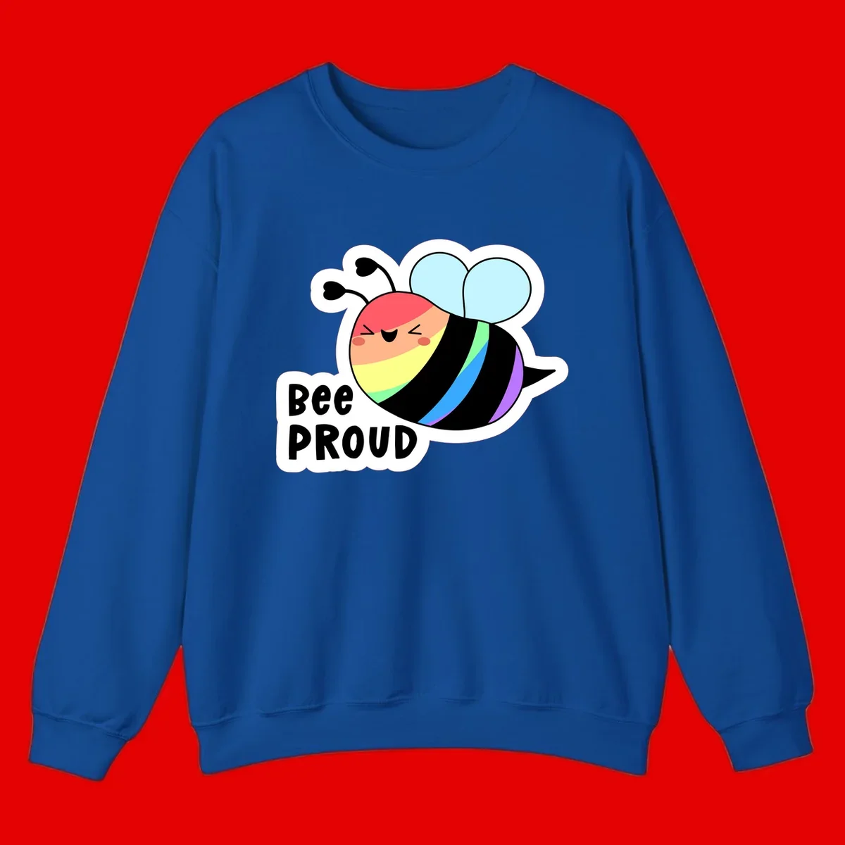 Cartoon bee with rainbow stripes and 'Bee PROUD' text celebrating LGBTQ+ pride