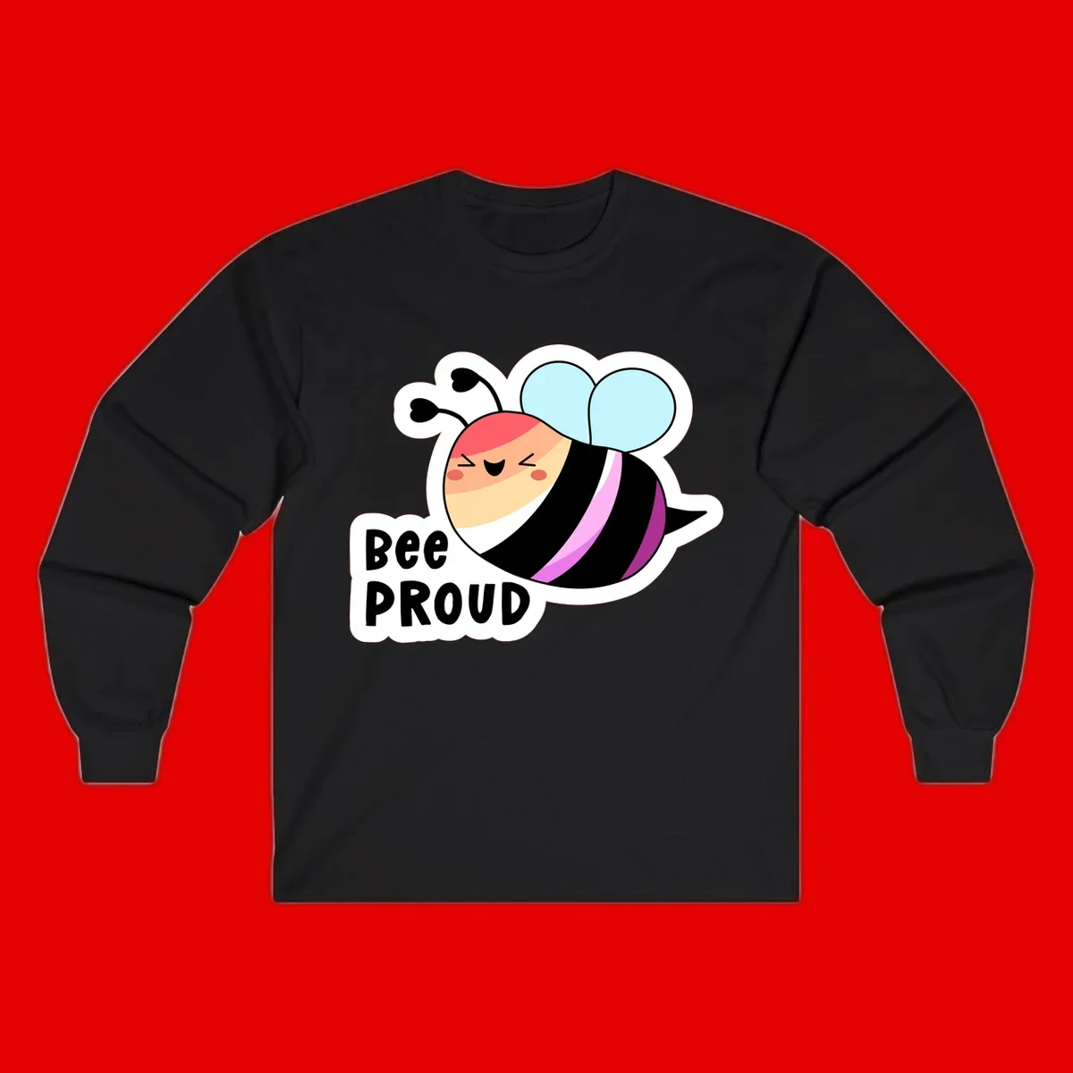Cheerful cartoon bee with peach face and pink-striped body next to 'Bee Proud' text celebrating pride and individuality