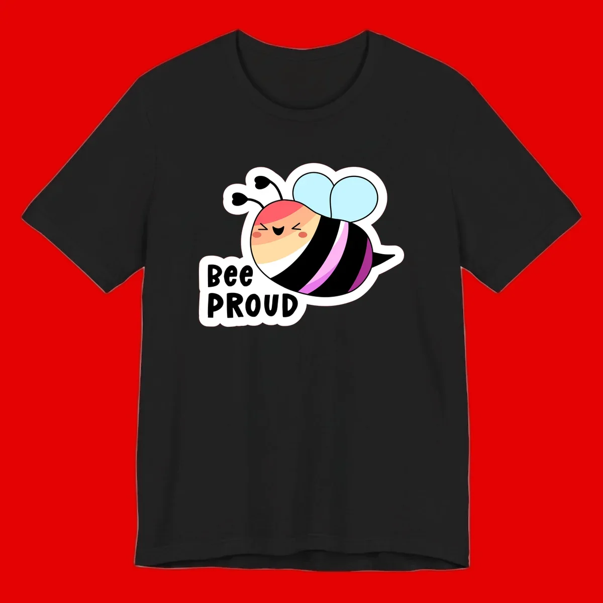 Cheerful cartoon bee with peach face and pink-striped body next to 'Bee Proud' text celebrating pride and individuality